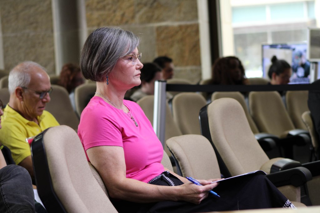 Nicole Holt of Texans for Safe and Drug-Free Youth waits to speak against the alcohol sales waiver for Wheatsville. Rebecca Butler/Reporting Texas
